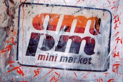 "Self-Portrait as Mini-Marketeer" (closeup) by Mikirk 2005 (acrylic on billboard paper ~6'x5')